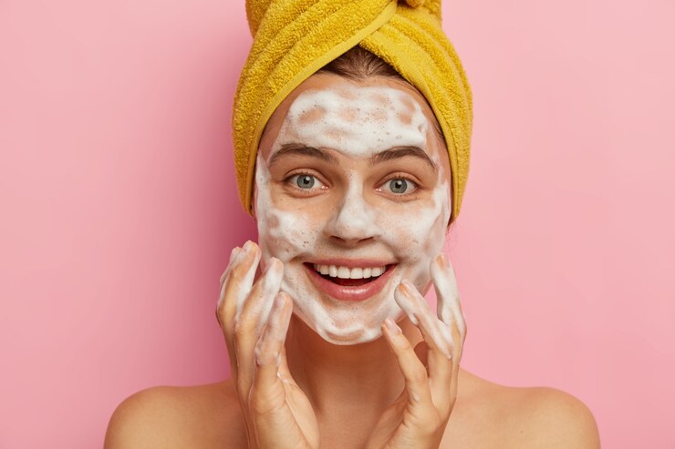 Girl washing her face 