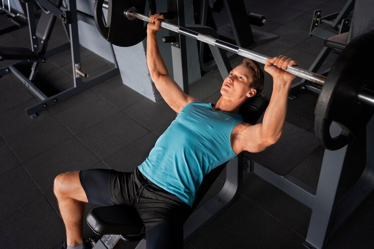 Man doing incline bench press for building chest